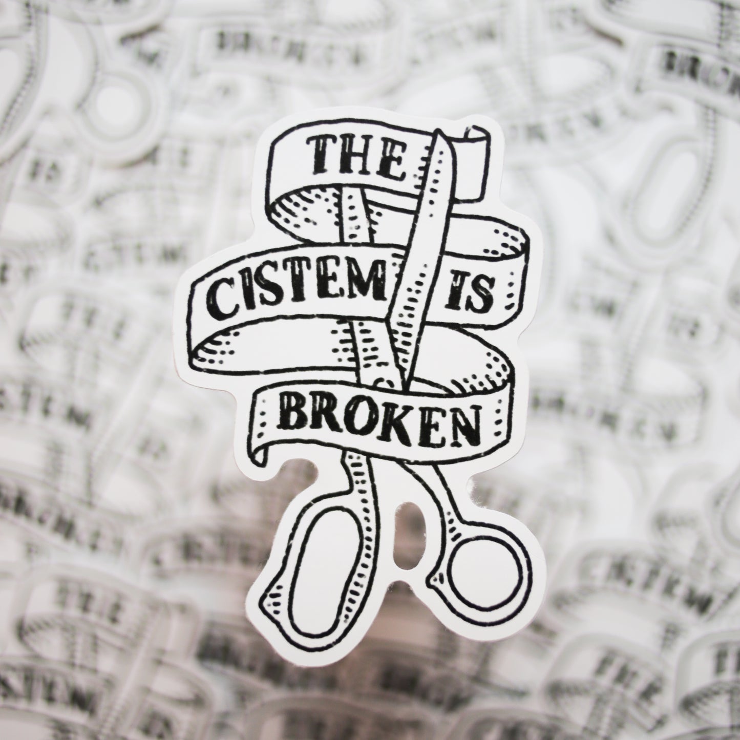 The Cistem is Broken Sticker – Ribbon & Scissors Design (4")